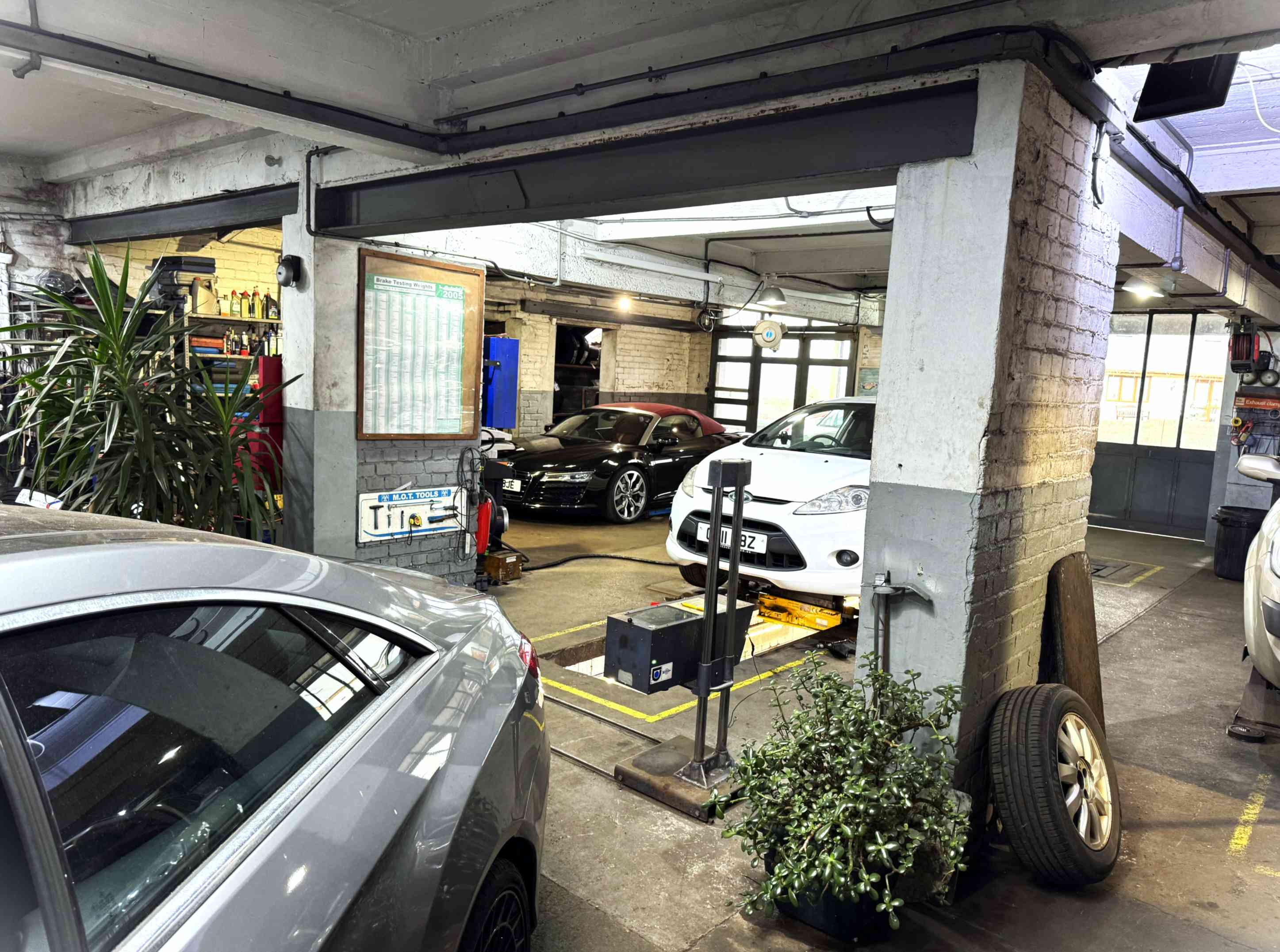Inside Vale AutoTec's vehicle service bay in South Wales